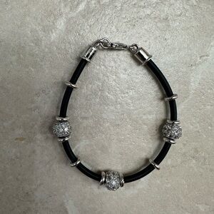 Black bracelet with clear sparkling beads.